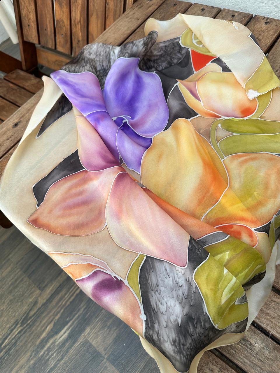 A finished hand-painted orchid silk scarf